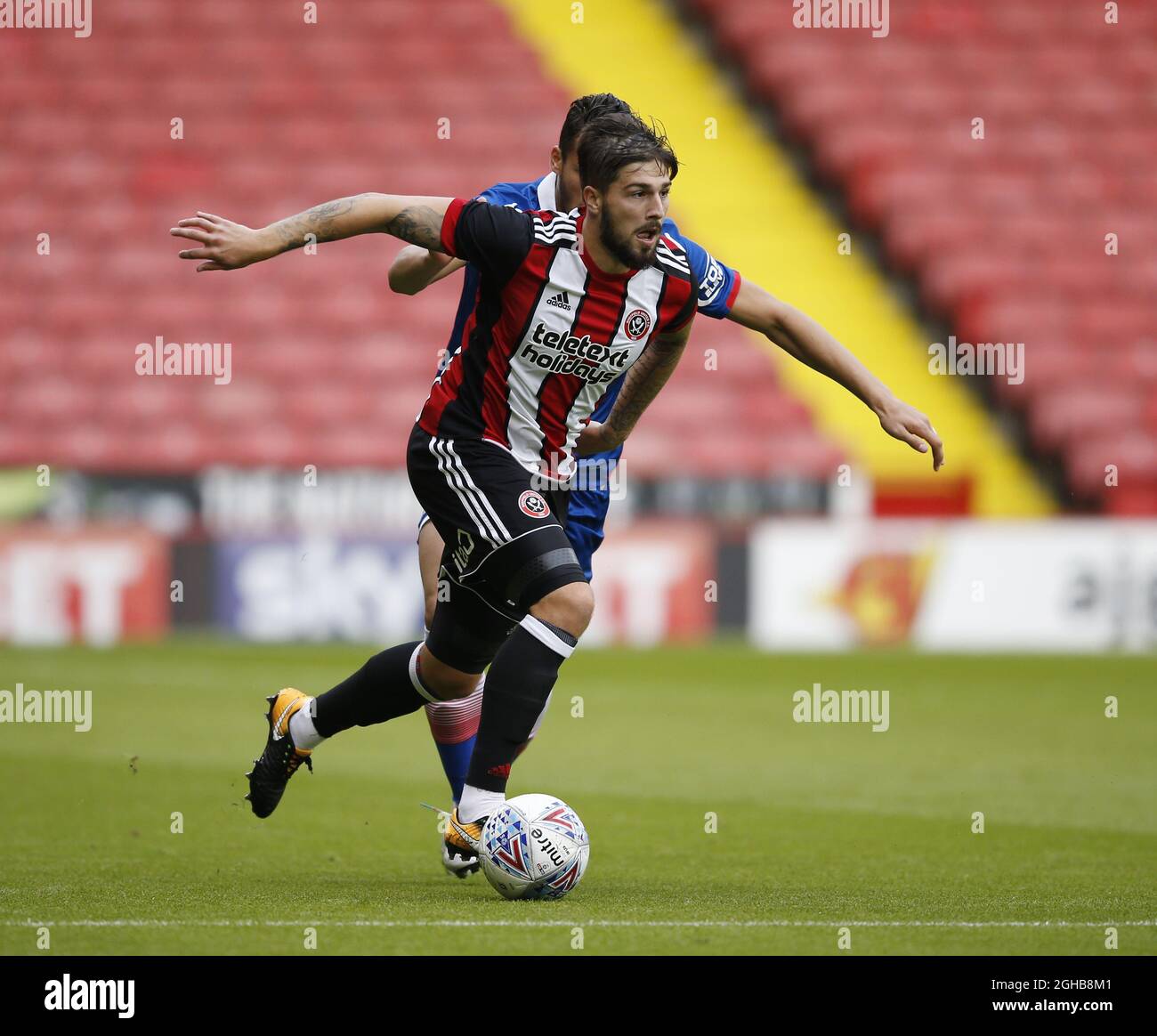 Kieron Freeman of Sheffield Utd tussles with Ramadan Sobhi of Stoke City during the pre season friendly at Bramall Lane Stadium, Sheffield. Picture date: July 25th 2017. Picture credit should read: Simon Bellis/Sportimage via PA Images Stock Photo