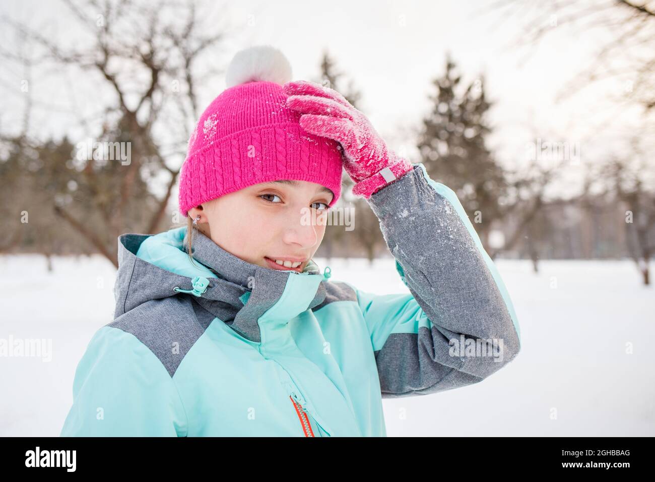 Teenage girl enjoying winter season in the park. Stock Photo