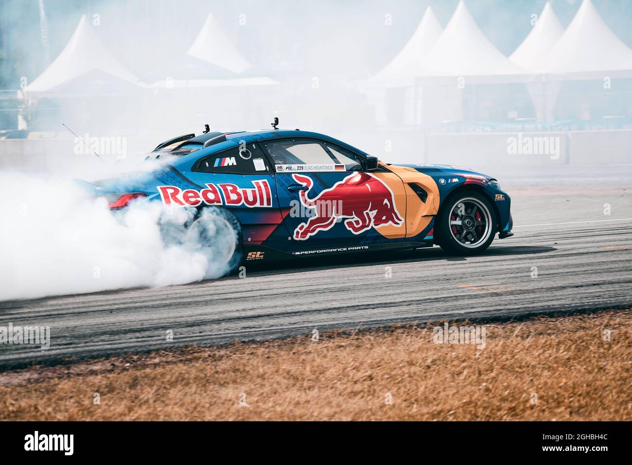 Futuristic sports car drifting in the neon street Stock Photo - Alamy