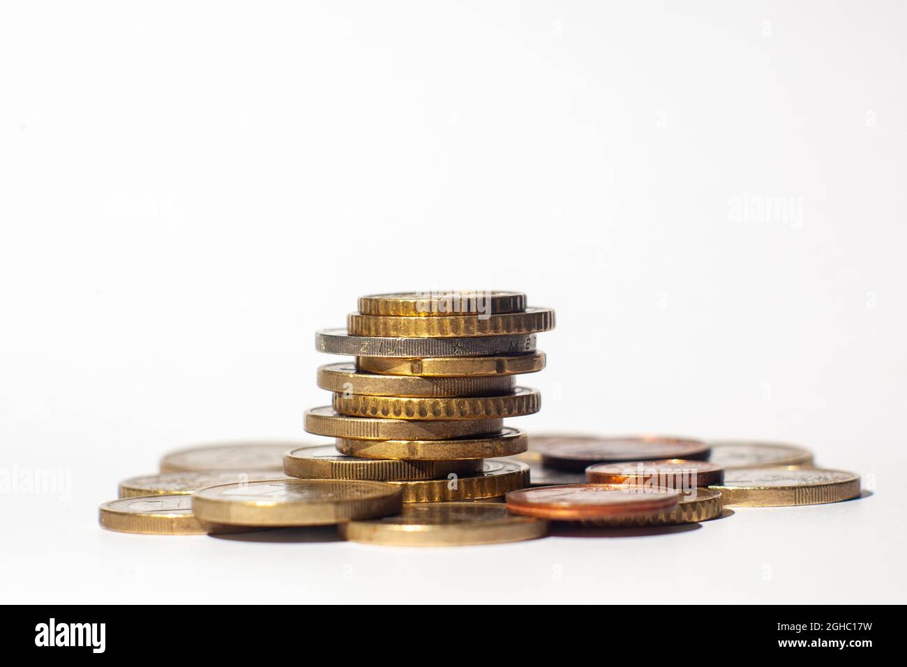 Stack of euro coins and white background Stock Photo - Alamy