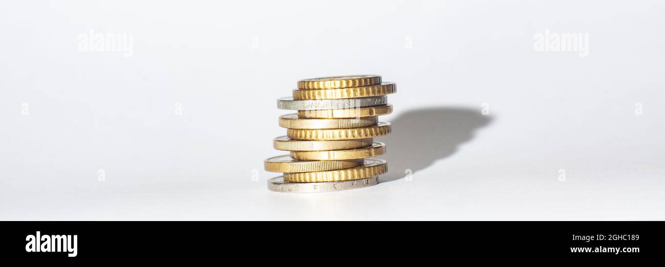 Stack of euro coins and white background. Stock Photo