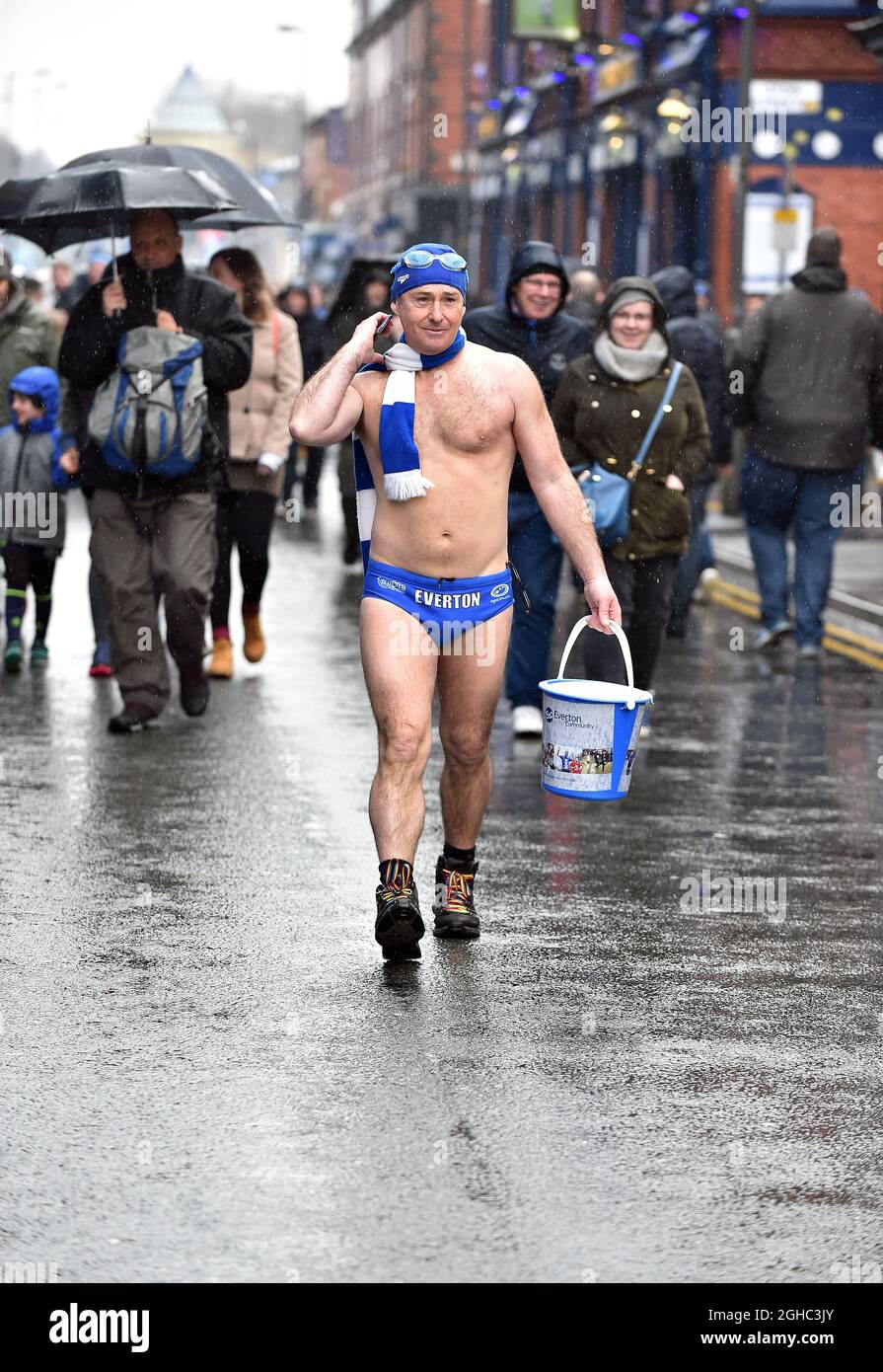 An Everton fan Speedo Mick walking in the rain outside Goodison Park before  the start of the premier league match at Goodison Park Stadium, Liverpool.  Picture date 6th April 2018. Picture credit