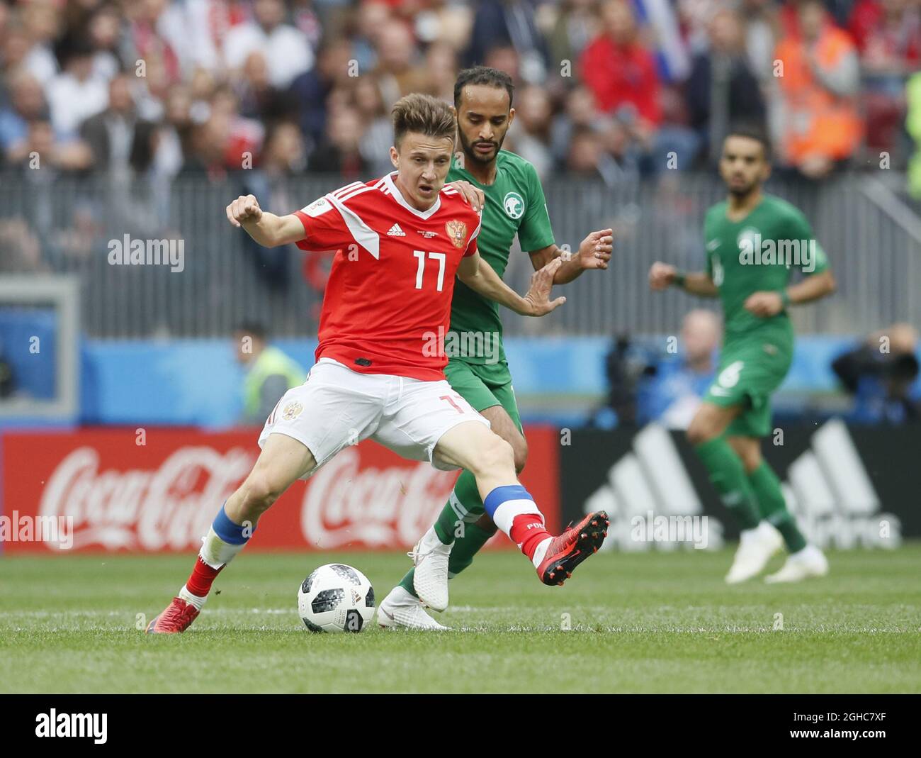 Aleksandr Samedov of Russia tackled by Alsahlawi Mohamed of Saudi Arabia during the FIFA World Cup 2018 Group A match at the Luzhniki Stadium, Moscow. Picture date 14th June 2018. Picture credit should read: David Klein/Sportimage via PA Images Stock Photo