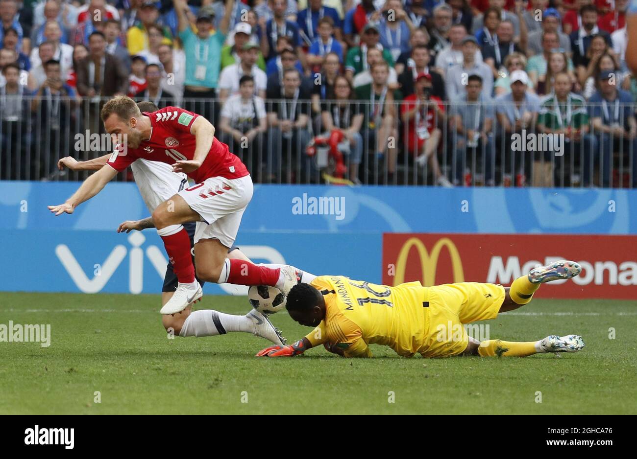 Steve Mandanda of France saves at the feet of Christian Eriksen of Denmark during the FIFA World Cup 2018 Group C match at the Luzhniki Stadium, Moscow. Picture date 26th June 2018. Picture credit should read: David Klein/Sportimage via PA Images Stock Photo