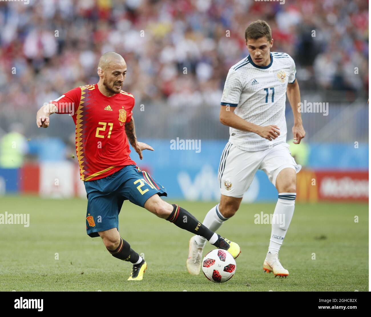 David Silva of Spain and Roman Zobnin of Russia during the FIFA World Cup 2018 Round of 16 match at the Luzhniki Stadium, Moscow. Picture date 1st July 2018. Picture credit should read: David Klein/Sportimage via PA Images Stock Photo