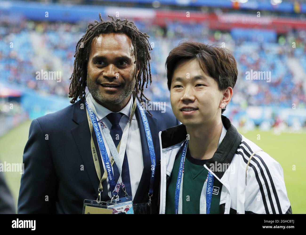 Retired French footballer Christian Karembeu has a selfie with a fan during the FIFA World Cup 2018 Semi Final match at the St Petersburg Stadium, St Petersburg. Picture date 10th July 2018. Picture credit should read: David Klein/Sportimage via PA Images Stock Photo