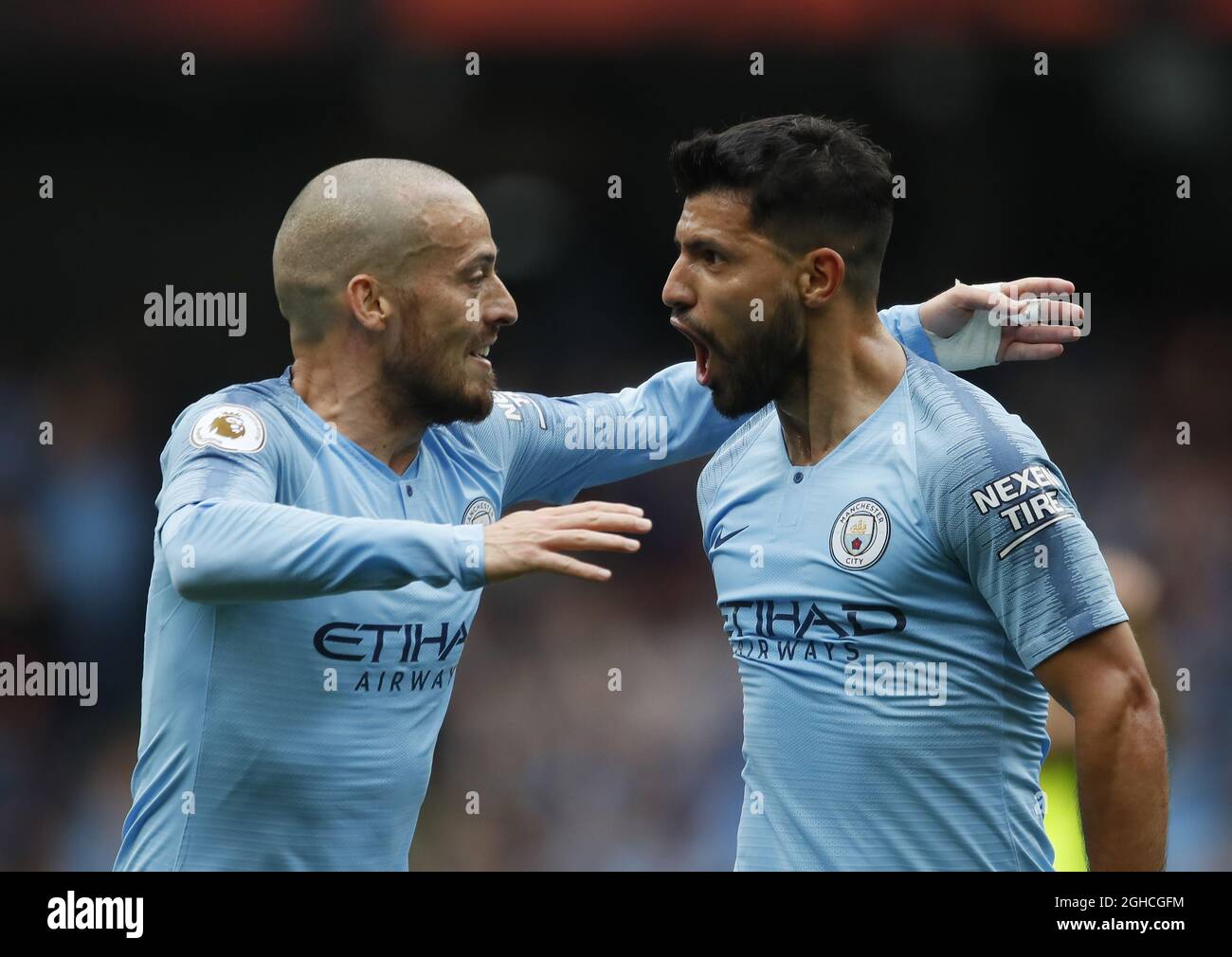 Sergio Aguero of Manchester City (r) celebrates scoring the first goal with David Silva of Manchester City (l) during the Premier League match at the Etihad Stadium, Manchester. Picture date 19th August 2018. Picture credit should read: Simon Bellis/Sportimage via PA Images Stock Photo