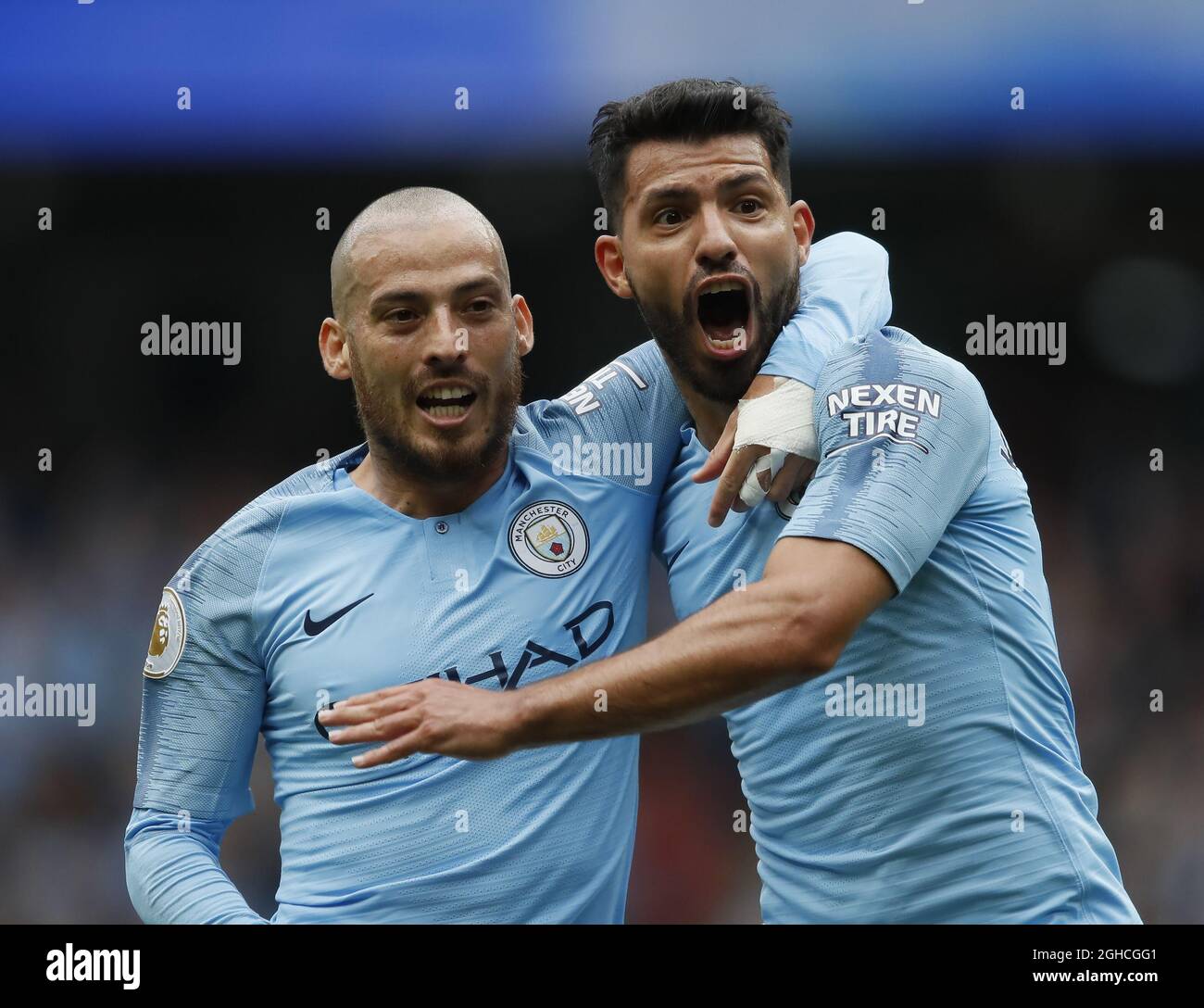 Sergio Aguero of Manchester City (r) celebrates scoring the first goal with David Silva of Manchester City (l) during the Premier League match at the Etihad Stadium, Manchester. Picture date 19th August 2018. Picture credit should read: Simon Bellis/Sportimage via PA Images Stock Photo