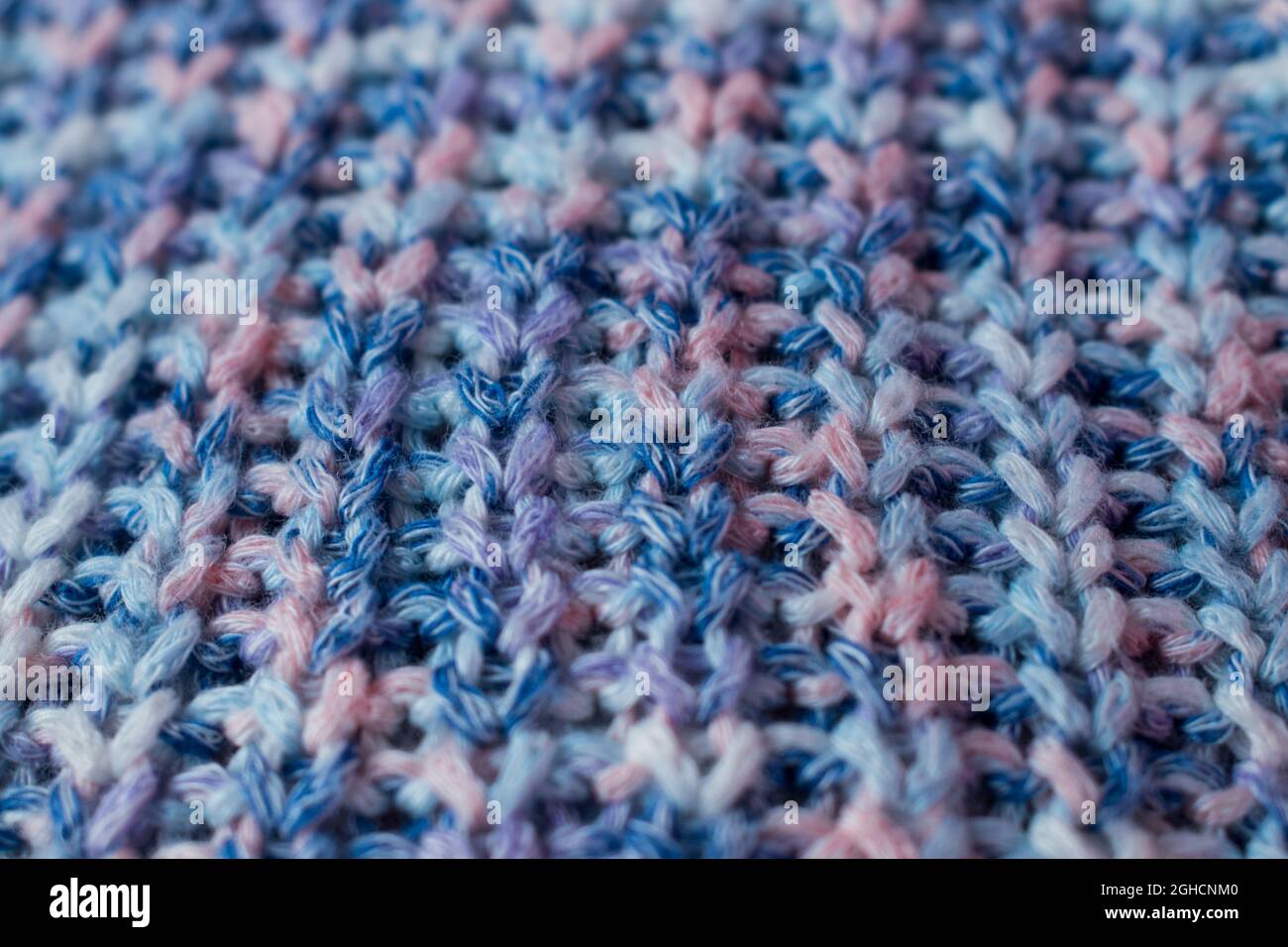 Close up of blue and pink knitted wool texture of a sweater Stock Photo