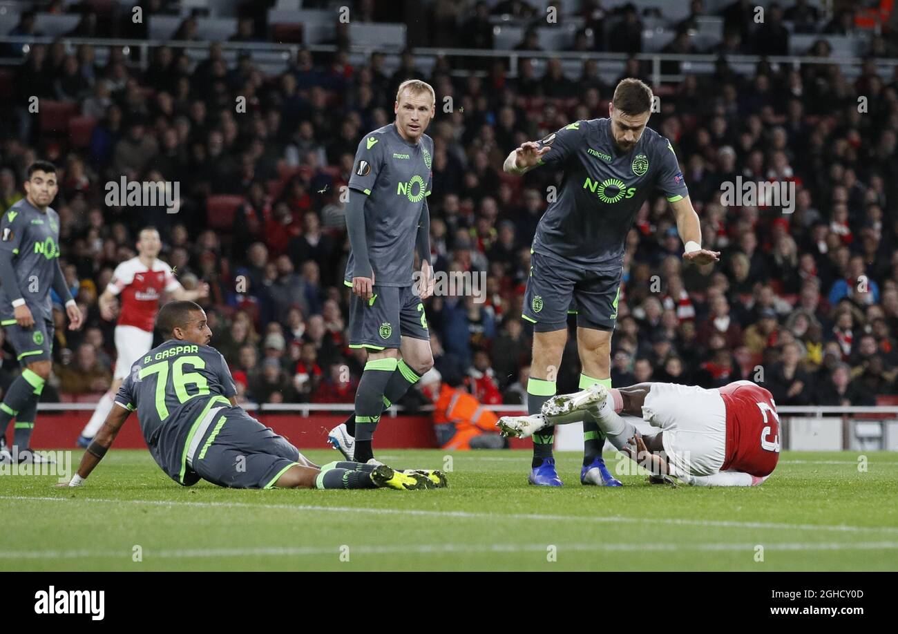 Bruno Gaspar of Sporting Lisbon looks on as Danny Welbeck of Arsenal goes down injured during the Europa League, Group E match at the Emirates Stadium, London. Picture date: 8th November 2018. Picture credit should read: David Klein/Sportimage  via PA Images Stock Photo