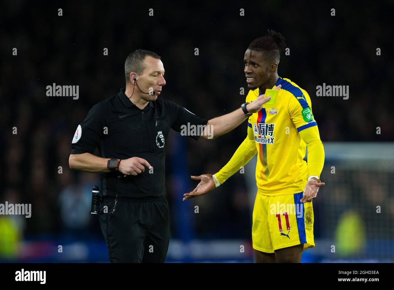Wilfried Zaha of Crystal Palace protests after being shown a yellow card by Referee Kevin Friend during the Premier League match at the American Express Community Stadium, Brighton. Picture date: 4th December 2018. Picture credit should read: Craig Mercer/Sportimage via PA Images Stock Photo