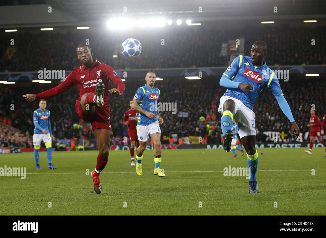 Georgina Wijnaldum of Liverpool lobs the ball over Kalidou Koulibaly of Napoli during the UEFA Champions League Group C match at Anfield Stadium, Liverpool. Picture date 11th December 2018. Picture credit should read: Andrew Yates/Sportimage via PA Images Stock Photo