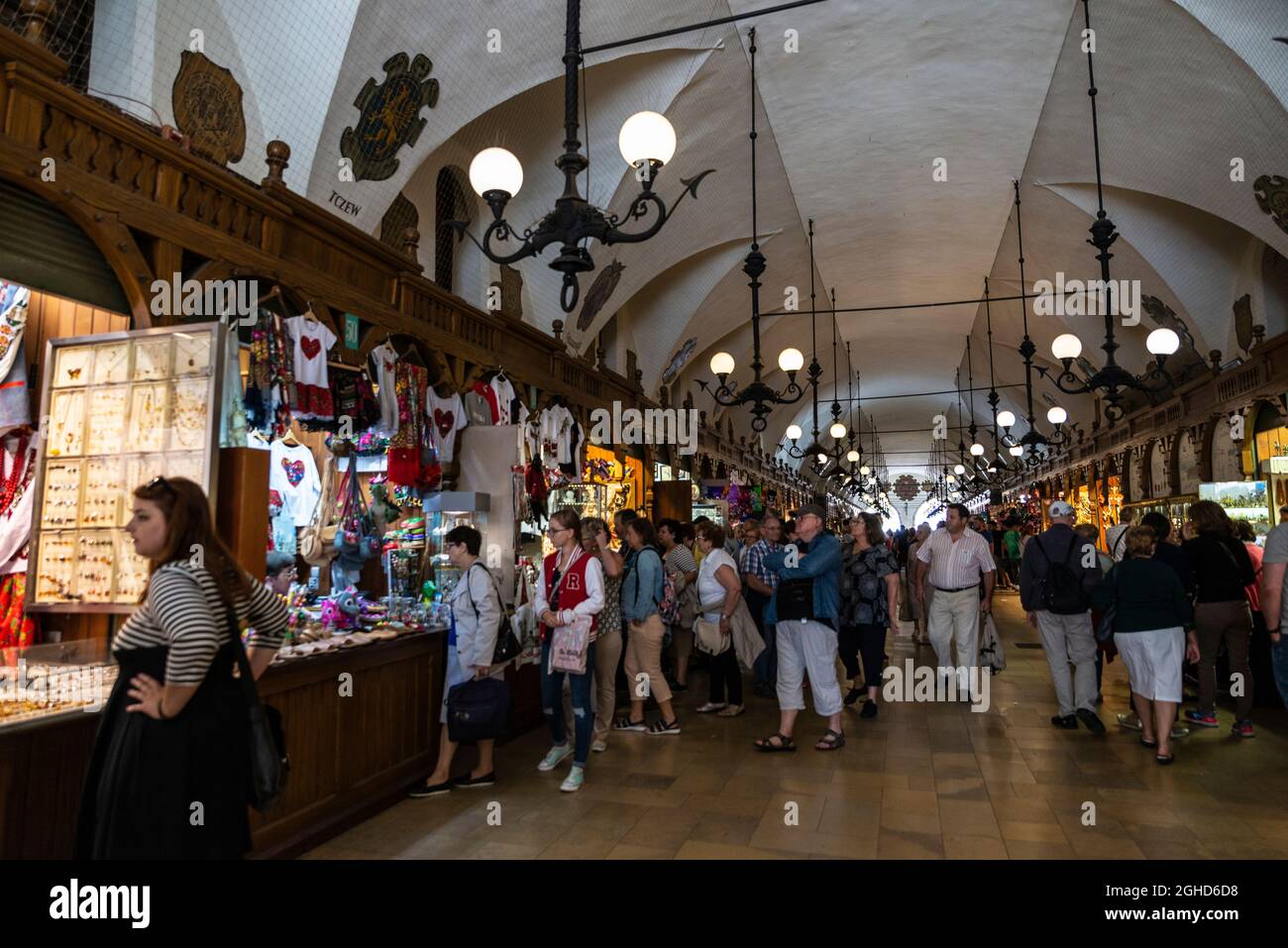 Krakow, Poland - August 28, 2018: Polish pottery shop in the Krakow Cloth Hall or Sukiennice in the Main Market Square or Rynek Glowny with people aro Stock Photo