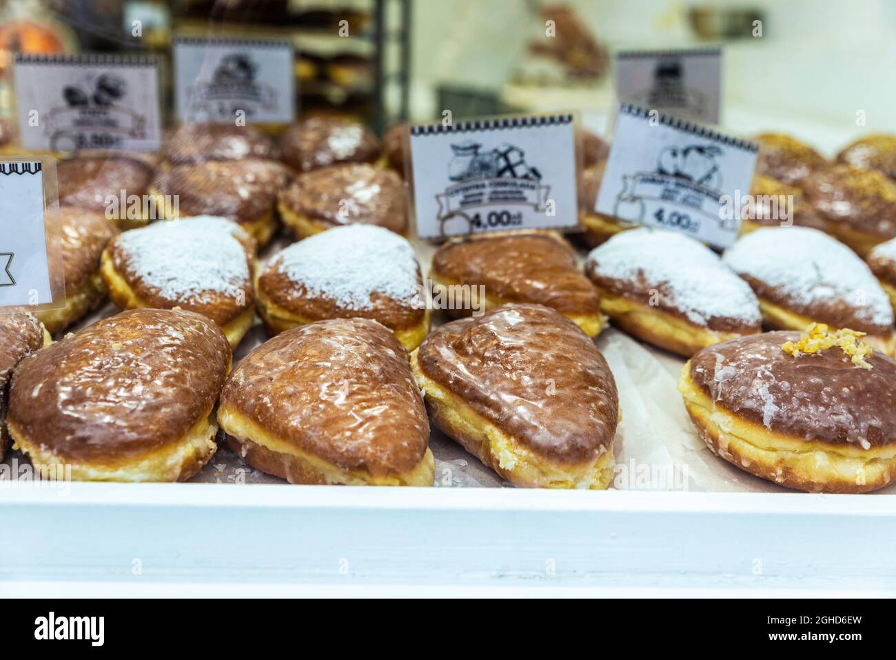 Krakow, Poland - August 28, 2018: Assortment of traditional Paczki in a pastry shop in the historical center of Krakow, Poland Stock Photo