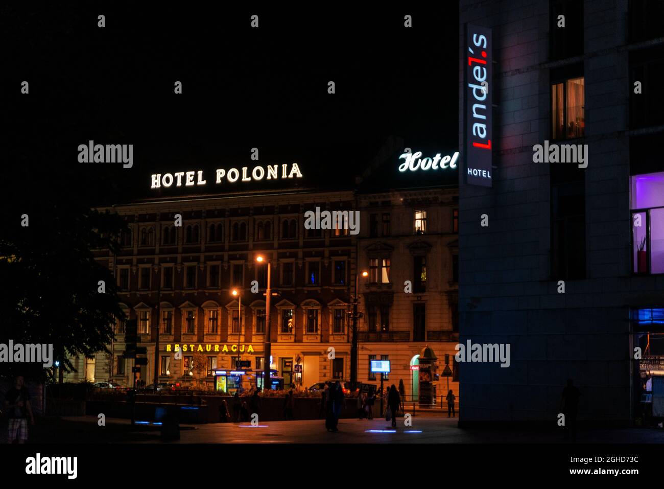 Krakow, Poland - August 30, 2018: Facade of the Polonia Hotel and the Landels hotel at night in Krakow, Poland Stock Photo