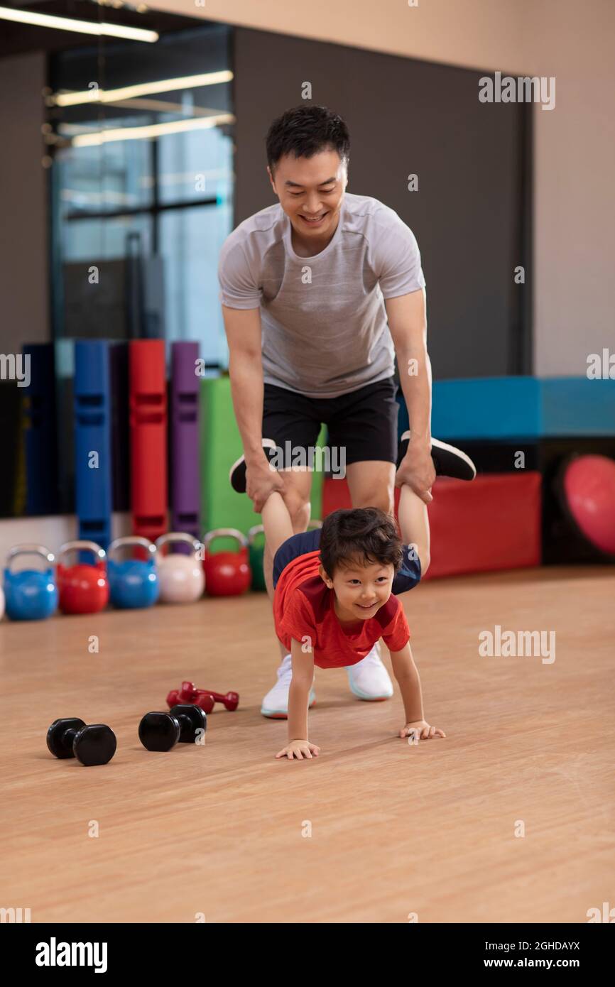 Little boy having exercise class in gym Stock Photo Alamy