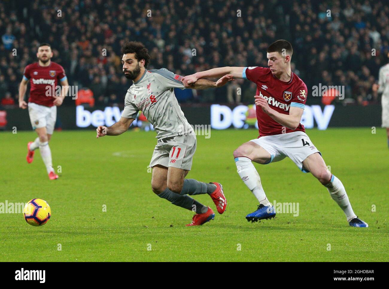 Mohamed Salah of Liverpool shackeld by Declan Rice of West Ham United  during the Premier League match at the London Stadium, London. Picture  date: 4th February 2019. Picture credit should read: Craig