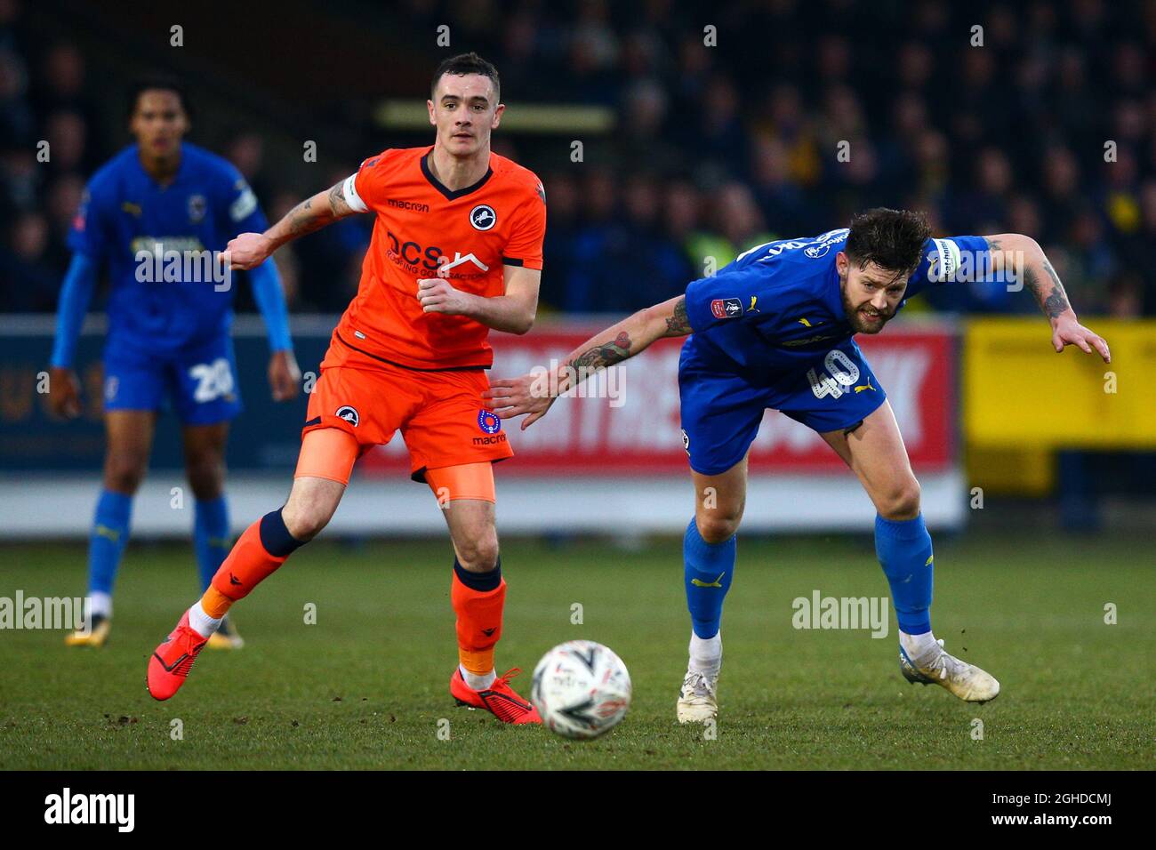 Shaun Williams of Millwall vies for possession with Anthony Wordsworth of AFC Wimbledon during the FA Cup Fifth Round match at the Cherry Red Records Stadium, London. Picture date: 16th February 2018. Picture credit should read: Craig Mercer/Sportimage via PA Images Stock Photo