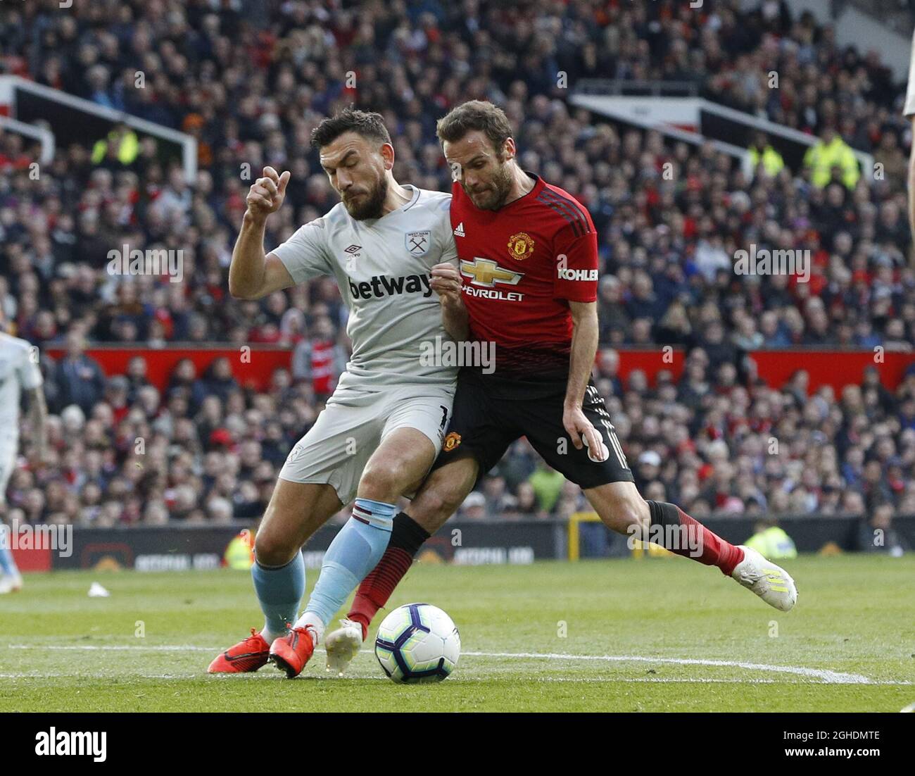 Robert Snodgrass of West Ham United challenges Juan Mata of Manchester United and Mata is awarded a penalty  during the Premier League match at Old Trafford, Manchester. Picture date: 13th April 2019. Picture credit should read: Darren Staples/Sportimage via PA Images Stock Photo