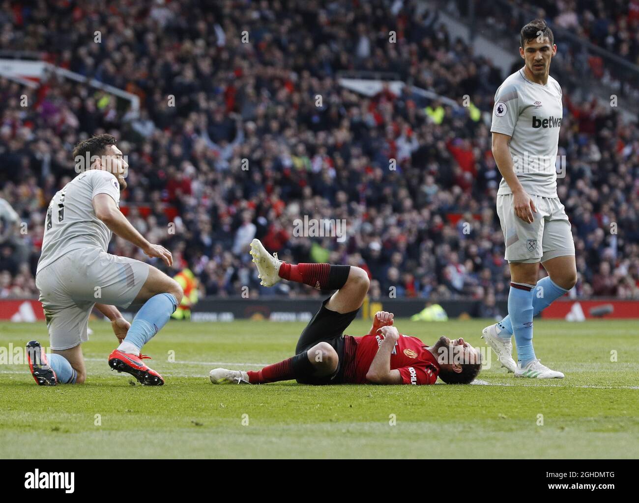 Robert Snodgrass of West Ham United challenges Juan Mata of Manchester United and Mata is awarded a penalty  during the Premier League match at Old Trafford, Manchester. Picture date: 13th April 2019. Picture credit should read: Darren Staples/Sportimage via PA Images Stock Photo
