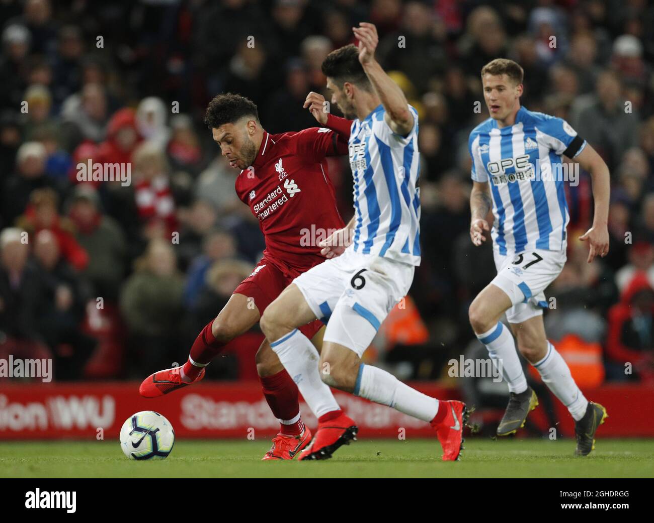 Alex Oxlade-Chamberlain of Liverpool jinks past Christopher Schindler ...