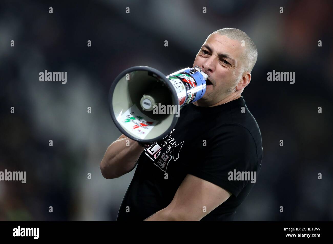 A Juventus Ultra shouts down his megaphone during the Serie A