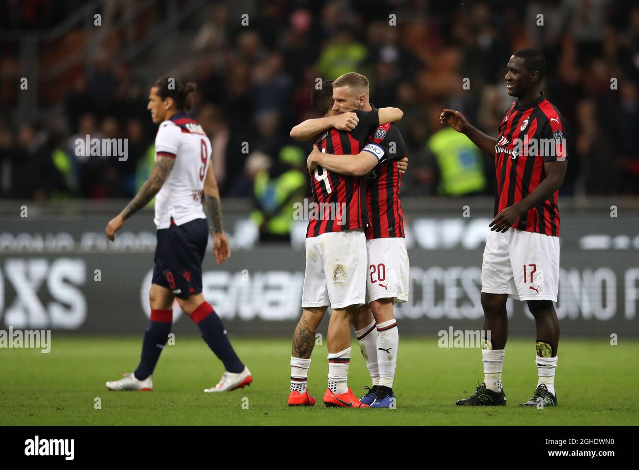 Cristian Zapata of AC Milan looks on as Ignazio Abate embraces Jose Mauri after the final whistle of the Serie A match at Giuseppe Meazza, Milan. Picture date: 6th May 2019. Picture credit should read: Jonathan Moscrop/Sportimage via PA Images Stock Photo
