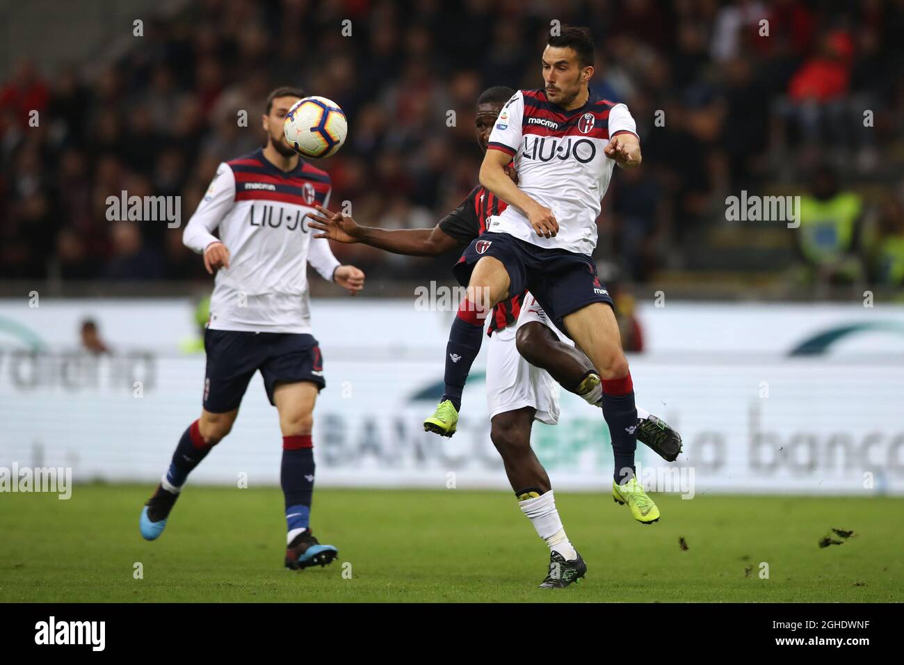 Nicola Sansone of Bologna battles with Cristian Zapata of AC Milan during the Serie A match at Giuseppe Meazza, Milan. Picture date: 6th May 2019. Picture credit should read: Jonathan Moscrop/Sportimage via PA Images Stock Photo