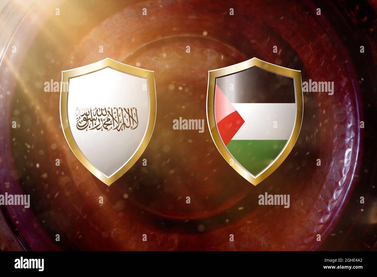 taliban and united states arab emirates flag in golden shield on copper texture background. Stock Photo