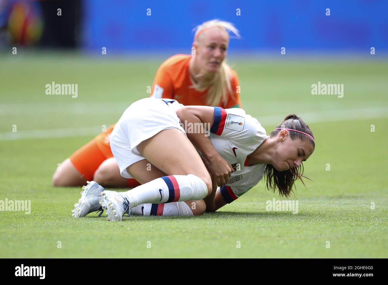 Alex Morgan of USA rolls in agony in the penalty area after being fouled by Stefanie Van Der Gragt of Holland to concede a penalty during the FIFA Women's World Cup match at Stade de Lyon, Lyon. Picture date: 7th July 2019. Picture credit should read: Jonathan Moscrop/Sportimage via PA Images Stock Photo