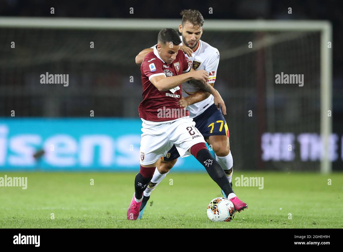 Alejandro Berenguer of Torino FC and Panagiotis Tachtsidis of Lecce during the Serie A match at Stadio Grande Torino, Turin. Picture date: 16th September 2019. Picture credit should read: Jonathan Moscrop/Sportimage via PA Images Stock Photo
