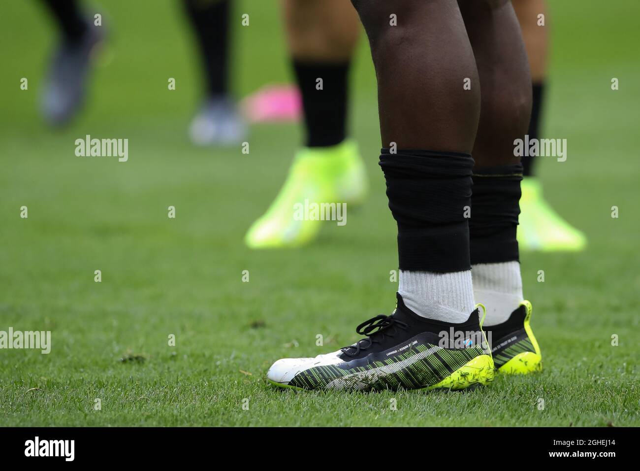 Romelu Lukaku of Inter's football boots carrying the name of his younger  brother and fellow footballer, Jordan along with flag of The Republic of  Congo on the left boot and the Belgian