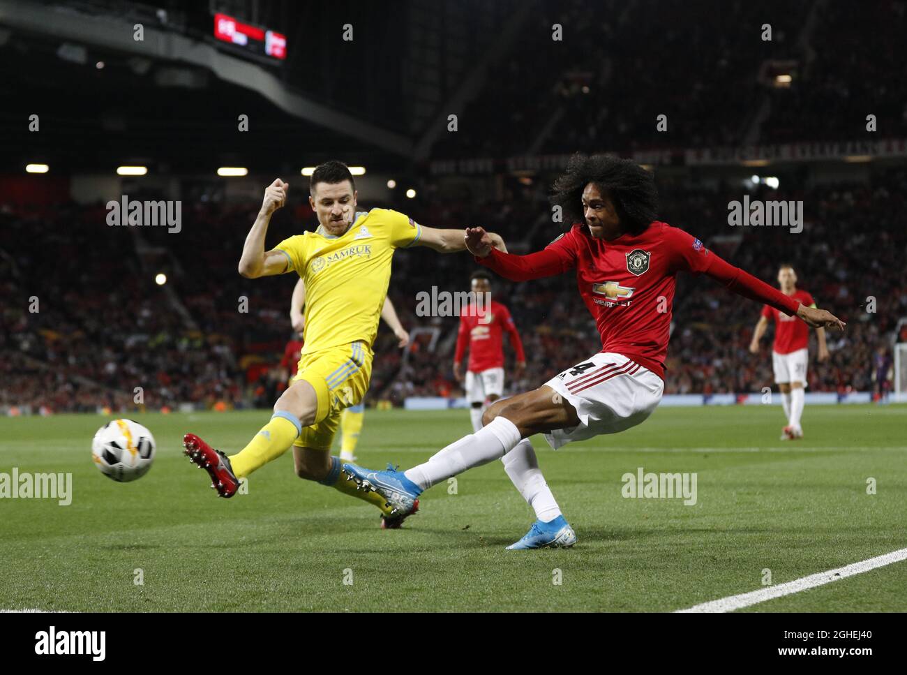 Tahith Chong of Manchester United crosses the ball past Antonio Rukavina of FC Astanaduring the UEFA Europa League match at Old Trafford, Manchester. Picture date: 19th September 2019. Picture credit should read: Darren Staples/Sportimage via PA Images Stock Photo