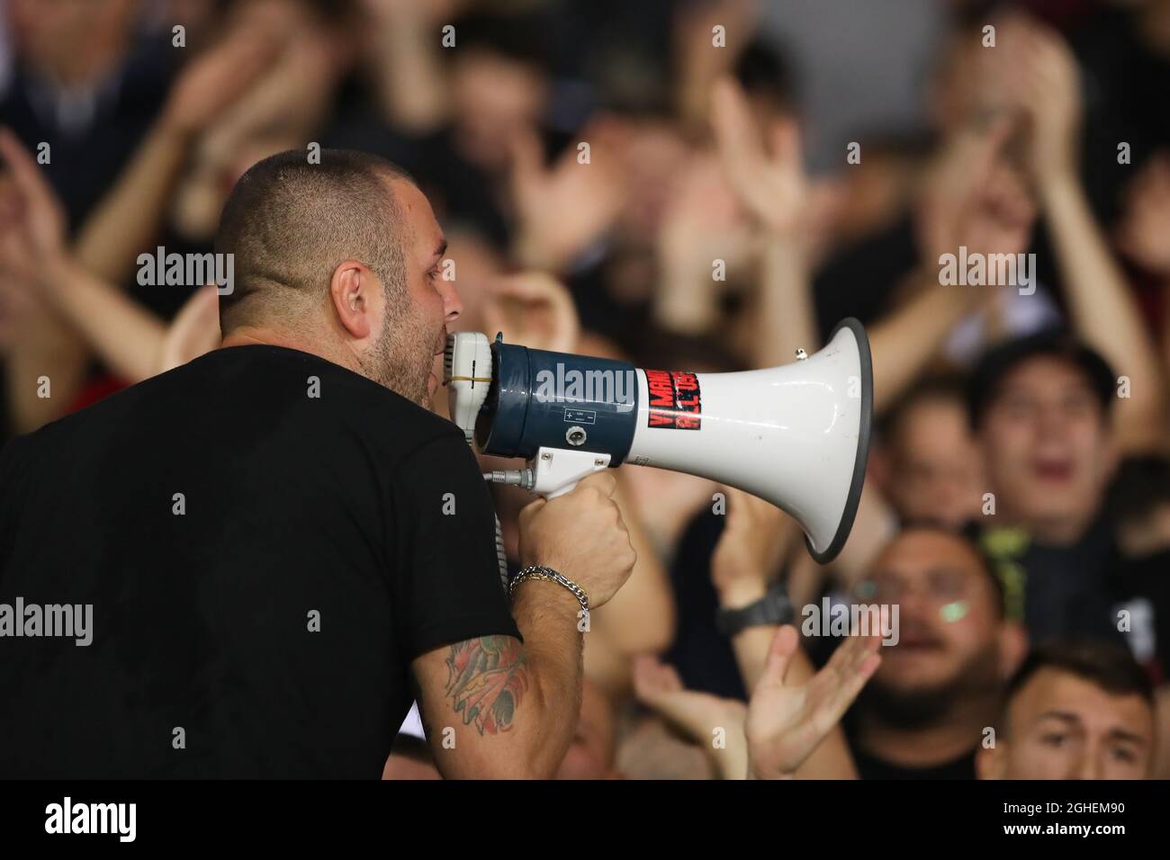 AN AC Milan Ultra use a megaphone to encourage fans to sing during the  Serie A match at Stadio Grande Torino, Turin. Picture date: 26th September  2019. Picture credit should read: Jonathan