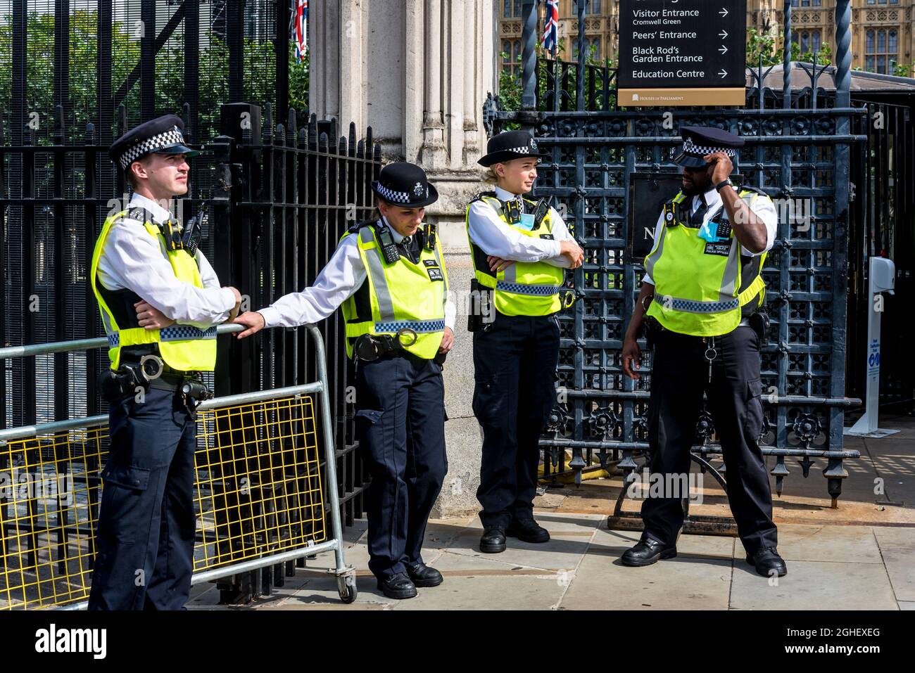 Police officers in front of the Houses of Parliament, Parliament Square ...