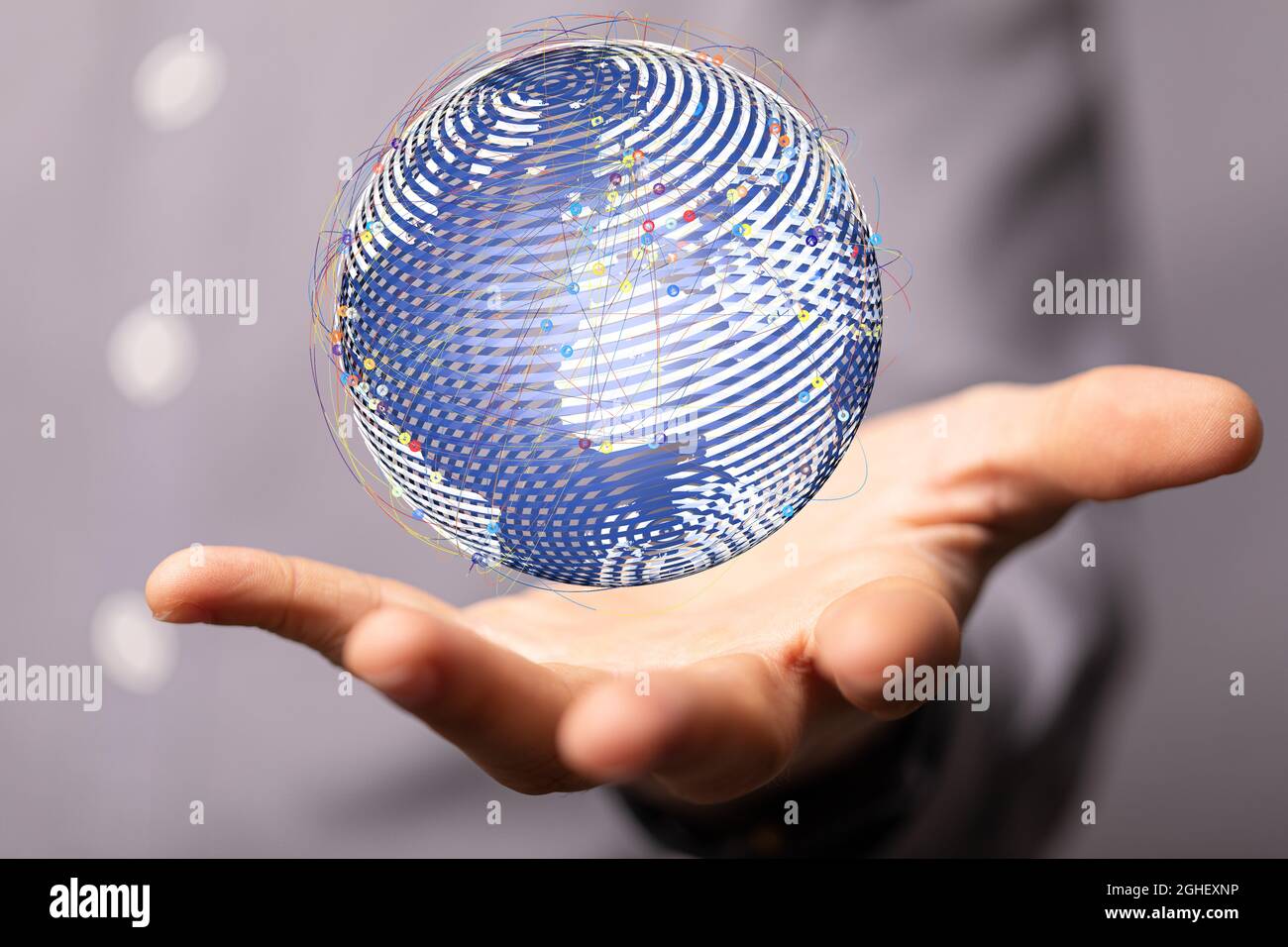 Closeup of a 3D rendered globe hologram hovering over a man's palm ...