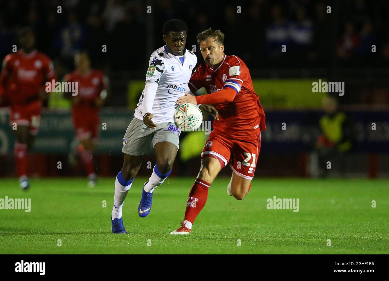 Colchester United's Kwame Poku and Crawley TownÕs Dannie Bulman challenge for the ball during the Carabao Cup match at Broadfield Stadium, Crawley. Picture date: 29th October 2019. Picture credit should read: Paul Terry/Sportimage via PA Images Stock Photo