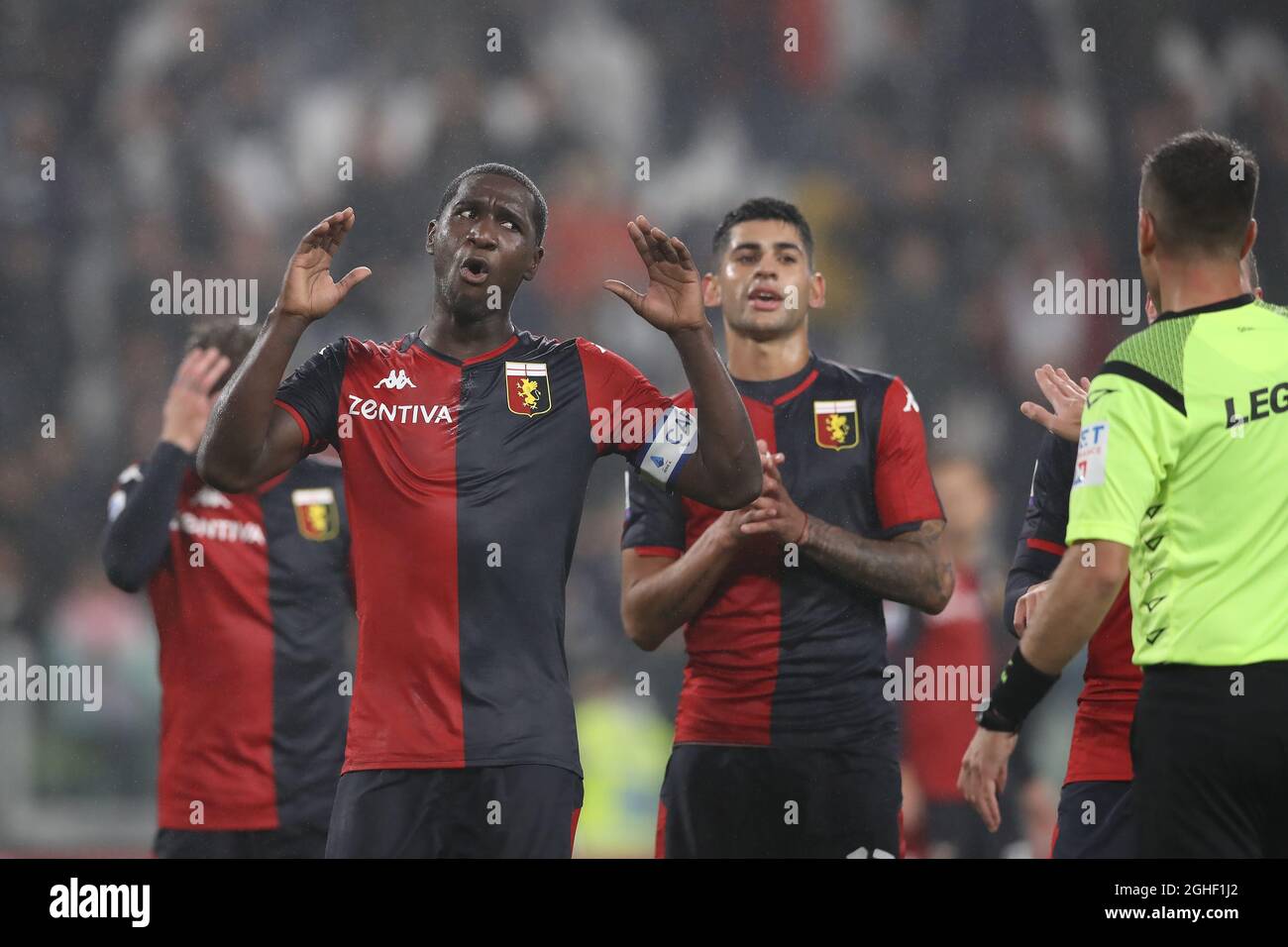 Genoa players Christian Zapata, Lasse Schone and Cristian Romero protest to the referee Antonio Giua after he awarded Juventus a 90th minute penalty during the Serie A match at Allianz Stadium, Turin. Picture date: 30th October 2019. Picture credit should read: Jonathan Moscrop/Sportimage via PA Images Stock Photo