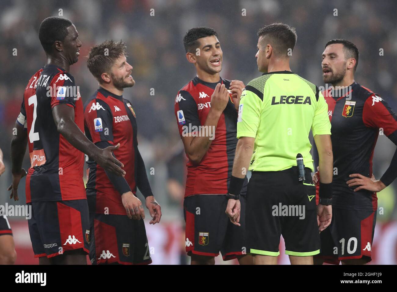 Genoa players Christian Zapata, Lasse Schone, Cristian Romero and Sinan Gumus protest to the referee Antonio Giua after he awarded Juventus a 90th minute penalty during the Serie A match at Allianz Stadium, Turin. Picture date: 30th October 2019. Picture credit should read: Jonathan Moscrop/Sportimage via PA Images Stock Photo