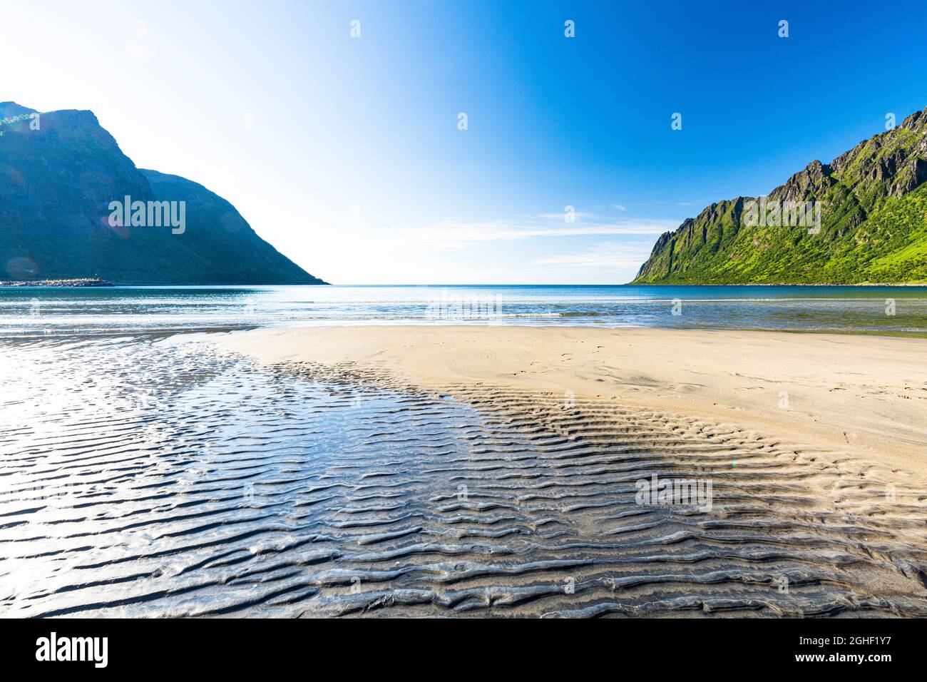 Sand shaped by wind on the large Ersfjord beach during the low tide, Senja, Troms county, Norway Stock Photo
