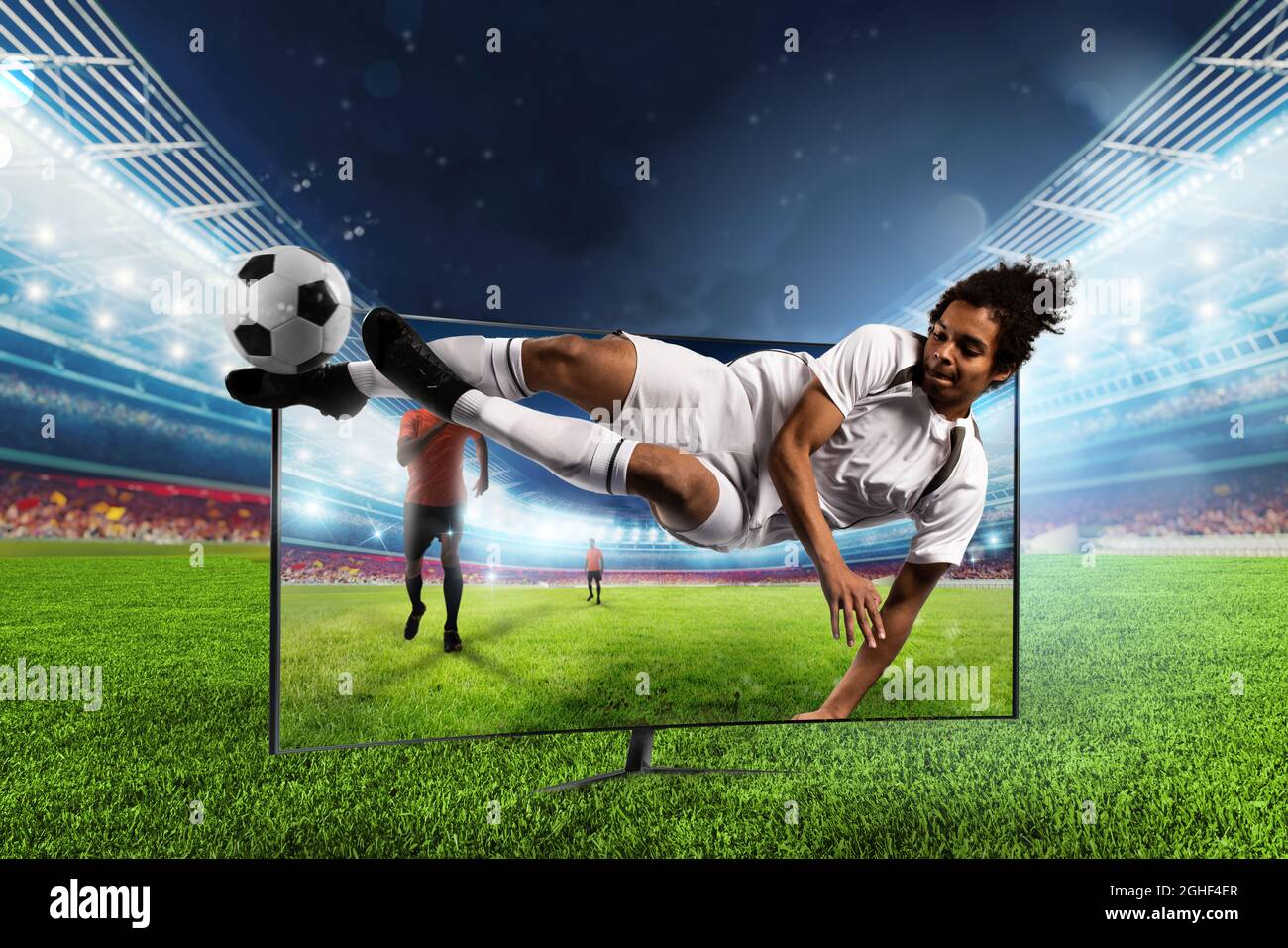 Streaming tv channel of soccer player who kicks the ball Stock Photo