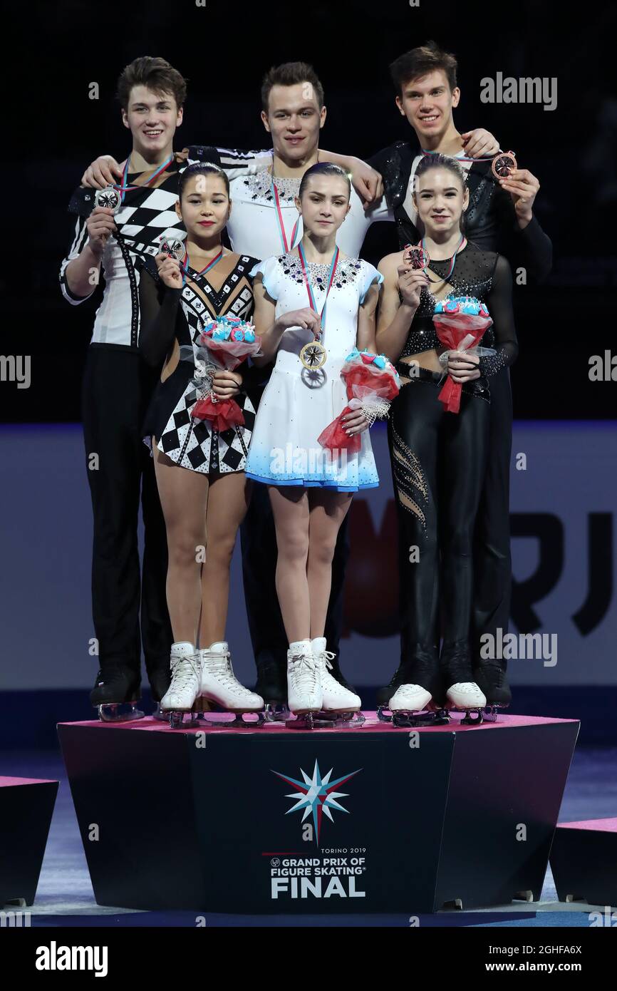 Junior Pairs' medal winners on the podium, ( L to R ), Silver medalists Diana Mukhametzianova and Ilya Mironov of Russia, Gold medalists Apollinariia Panfilova and Dmitry Rylov of Russia and Bronze medalists Kseniia Akhnateva and Valerii Kolesov of Russia at Palavela, Turin. Picture date: 7th December 2019. Picture credit should read: Jonathan Moscrop/Sportimage via PA Images Stock Photo