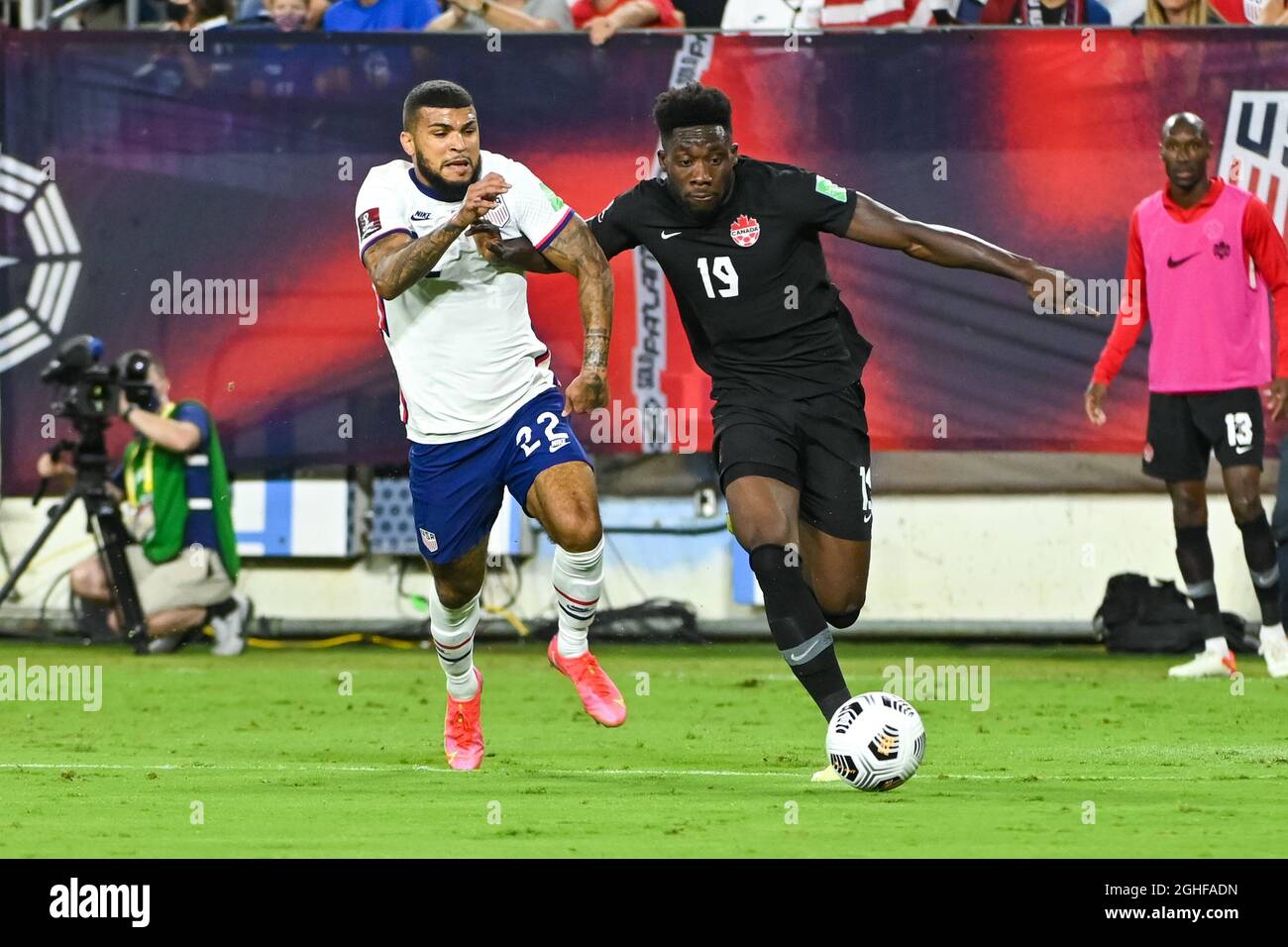 Nashville, TN, USA. 05th Sep, 2021. Canada defender Alphonso Davies (19), and US defender DeAndre Yedlin (22), fight for the ball during the World Cup qualifying match between Canada and the USA, at Nissan Stadium in Nashville, TN. Kevin Langley/CSM/Alamy Live News Stock Photo