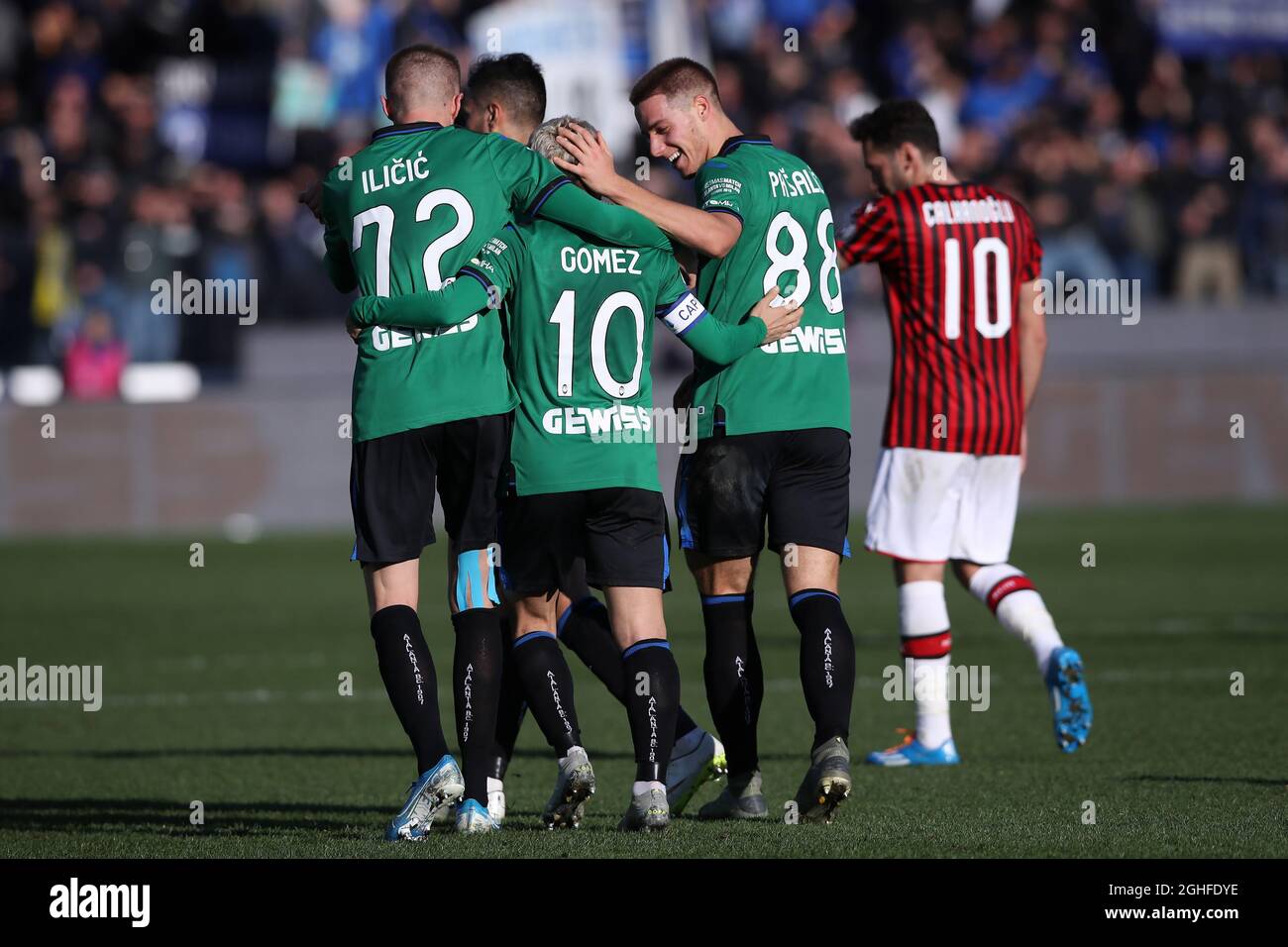 Josip Ilicic of Atalanta celebrates with team mates Alejandro Gomez and Mario Pasalic after scoring his second goal to give the side a 4-0 lead during the Serie A match at Gewiss Stadium, Bergamo. Picture date: 22nd December 2019. Picture credit should read: Jonathan Moscrop/Sportimage via PA Images Stock Photo
