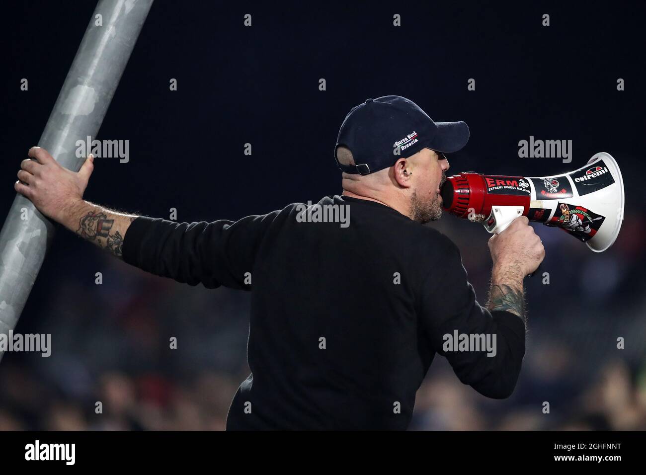AN AC Milan Ultra encourages fans to sign using a megaphone during the  Serie A match at Stadio Mario Rigamonti, Brecsia. Picture date: 24th  January 2020. Picture credit should read: Jonathan Moscrop/Sportimage