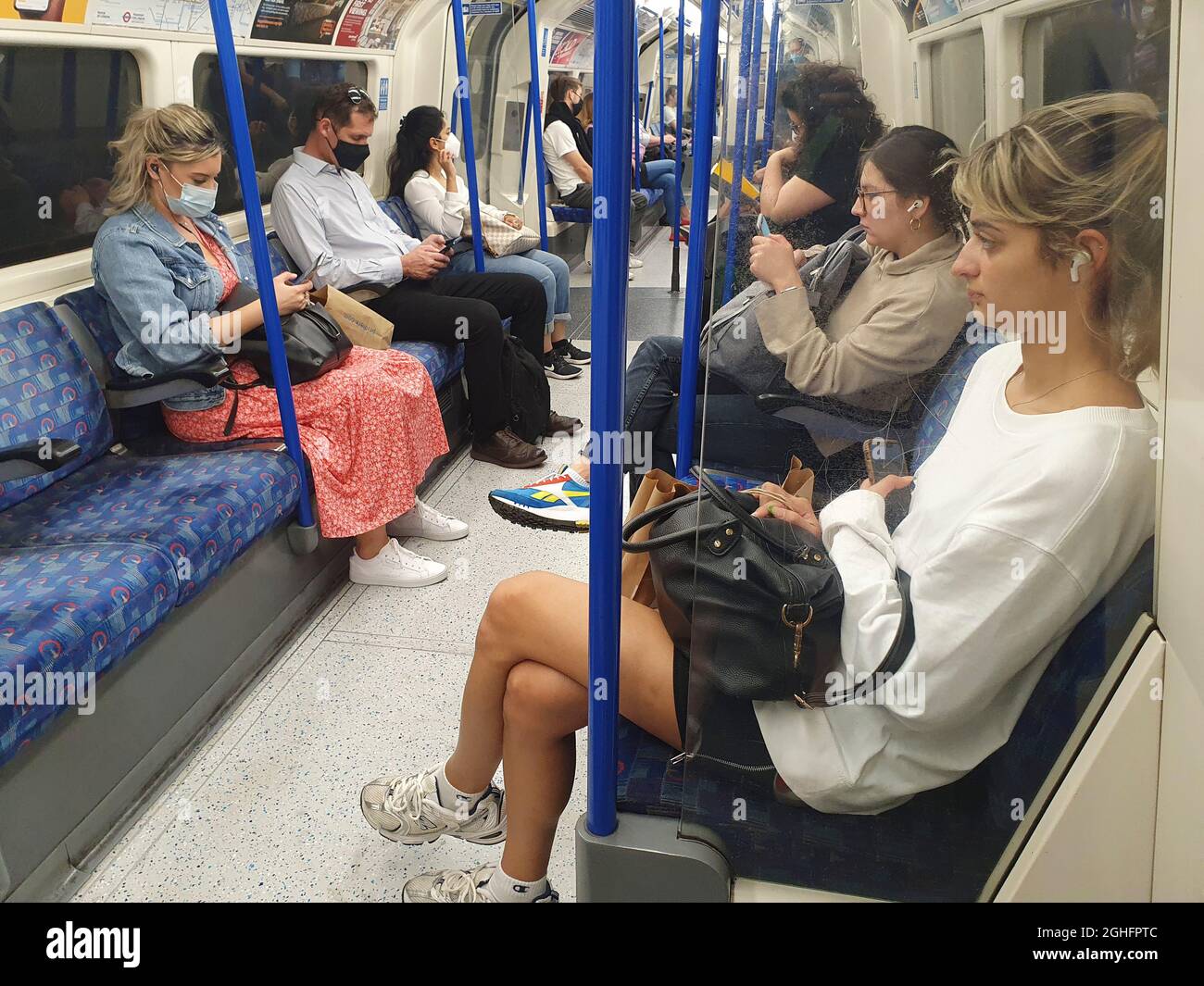 London, UK, 6 September 2021: On the Northern Line of the London Underground in the middle of the day, not all passengers are wearing face masks. Although it is a condition of carriage to wear a face mask according to Transport for London regulations, people do not have to wear them if they have a medical exemption and enforcement for non-compliance seems low. Anna Watson/Alamy Live News Stock Photo