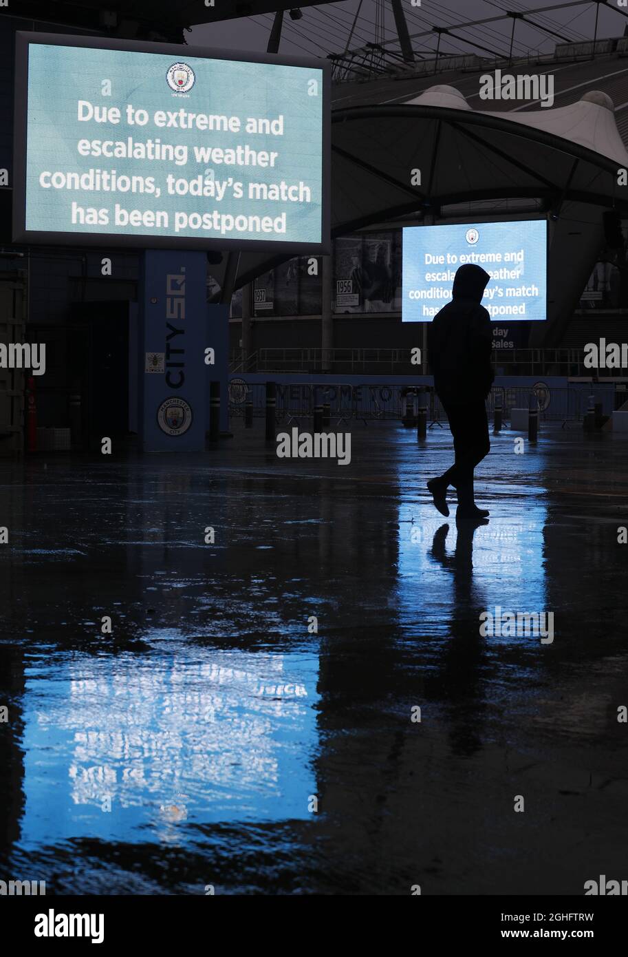 A Worker leaves after the Premier League match between Manchester City and West Ham United was postponed because of weather conditions at the Etihad Stadium, Manchester. Picture date: 9th February 2020. Picture credit should read: Darren Staples/Sportimage via PA Images Stock Photo