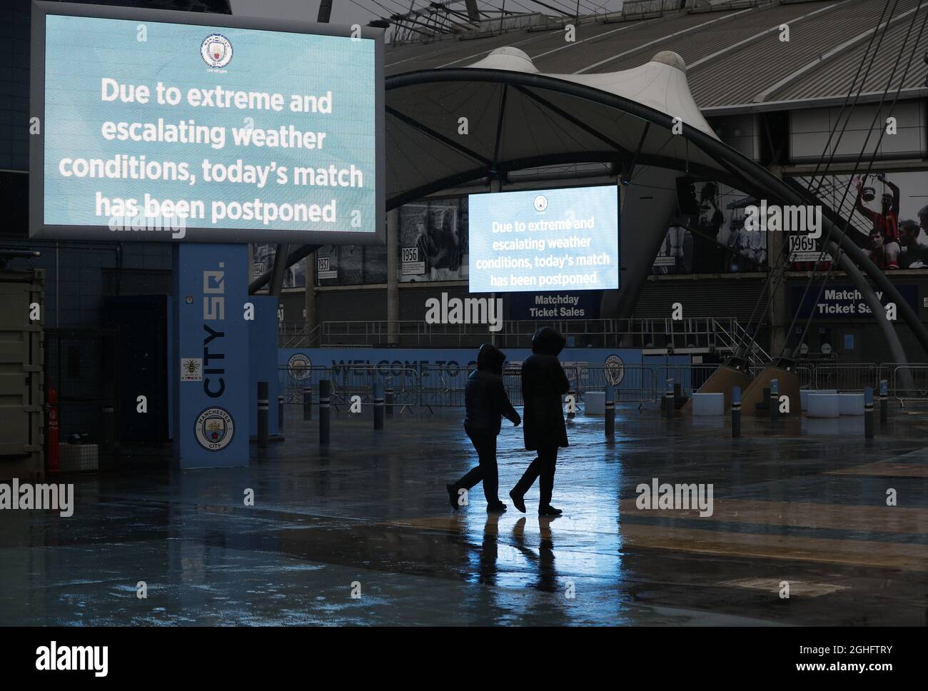 Workers leave after the Premier League match between Manchester City and West Ham United was postponed because of weather conditions at the Etihad Stadium, Manchester. Picture date: 9th February 2020. Picture credit should read: Darren Staples/Sportimage via PA Images Stock Photo