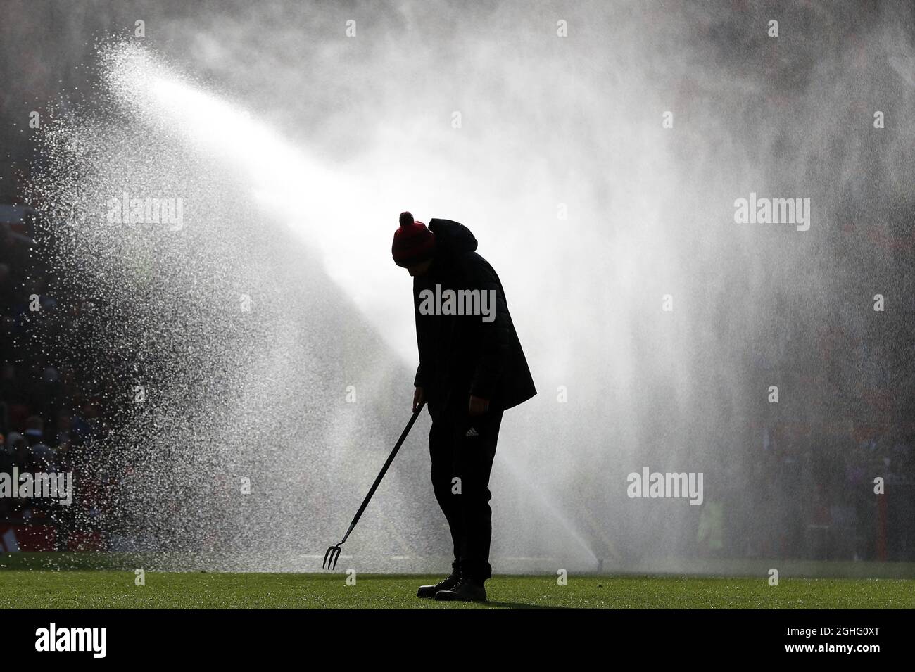 A Manchester United groundsman prepares the pitch before the Premier League match against Watford at Old Trafford, Manchester. Picture date: 23rd February 2020. Picture credit should read: Darren Staples/Sportimage via PA Images Stock Photo