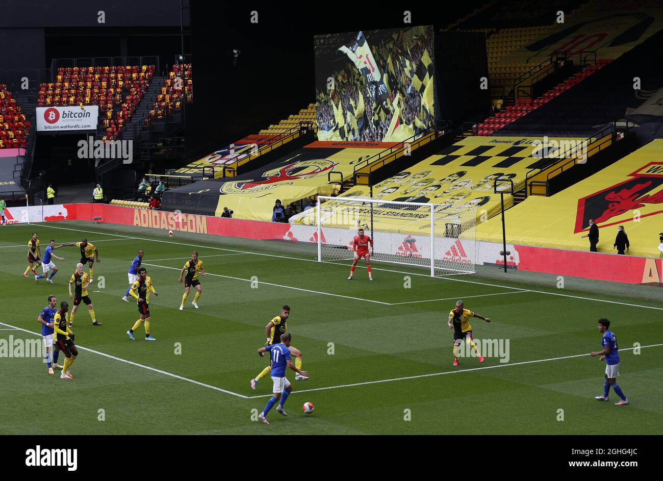 A giant screen showing pictures of fans plays out in front of the teams during the Premier League match at Vicarage Road, Watford. Picture date: 20th June 2020. Picture credit should read: Darren Staples/Sportimage via PA Images Stock Photo